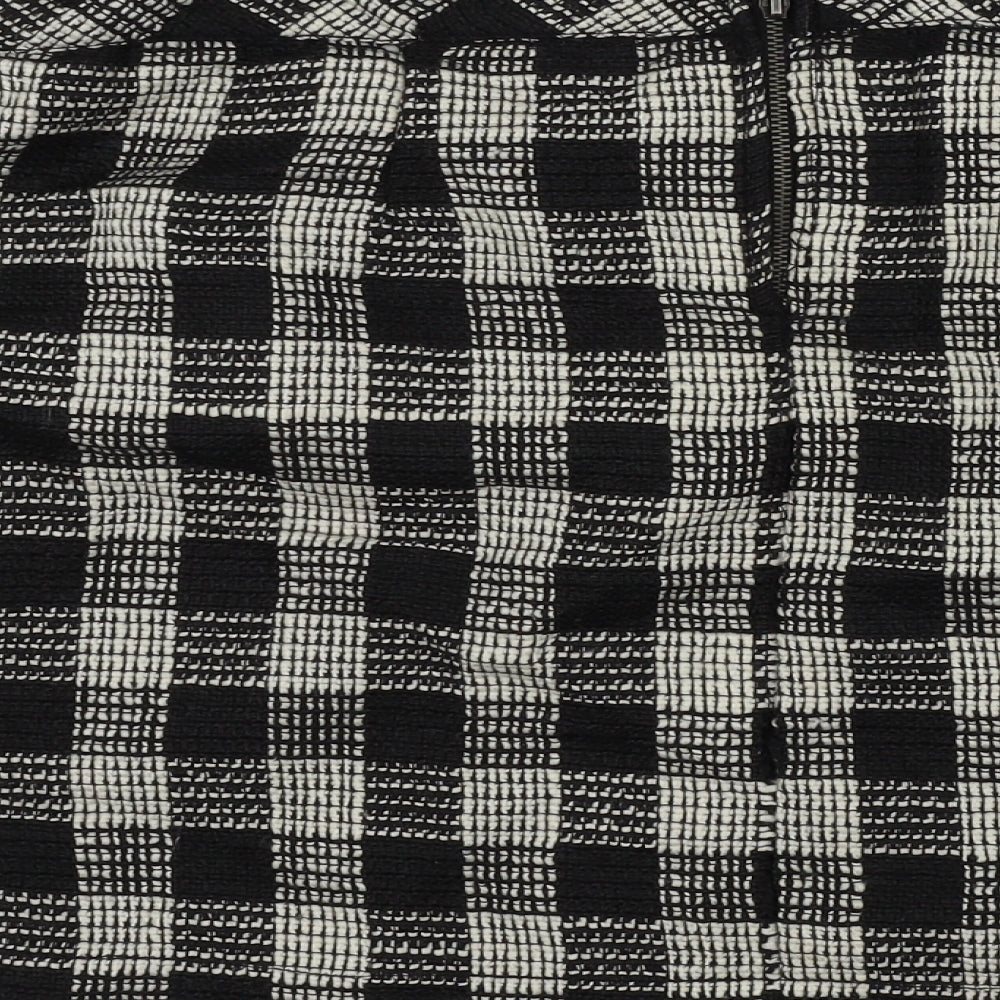 Brand and care label for Gina women’s black check a-line skirt, size UK 24, in