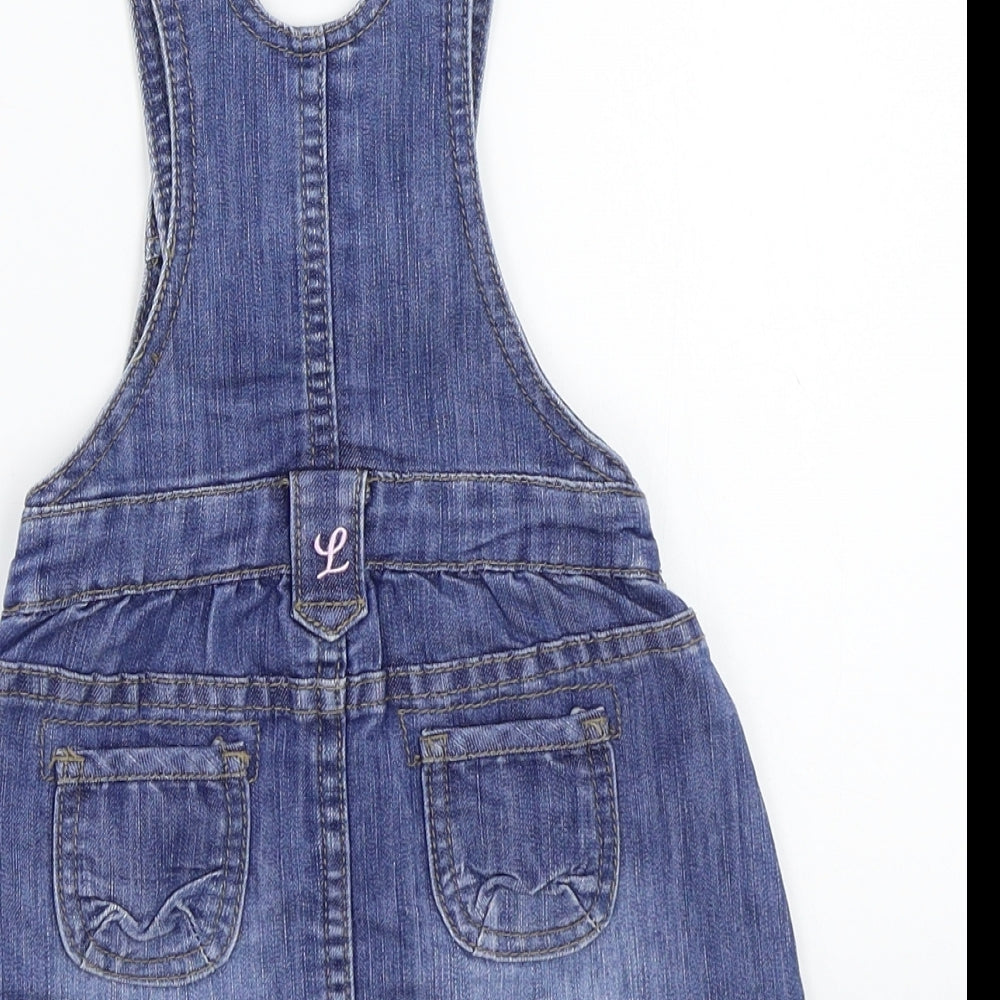 Brand and care label for H&M girls’ blue a-line, size 6-9, months