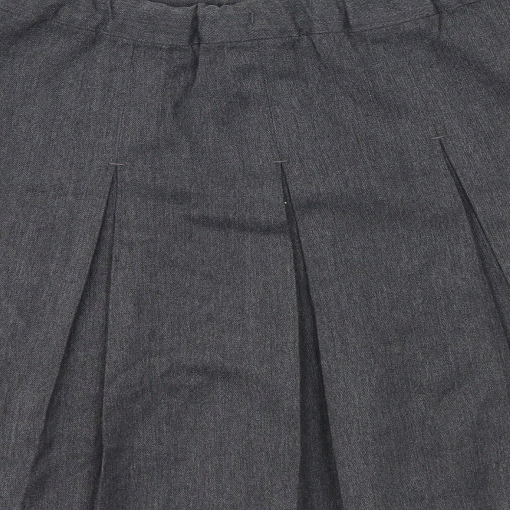Brand and care label for Preworn girls’ grey pleated skirt