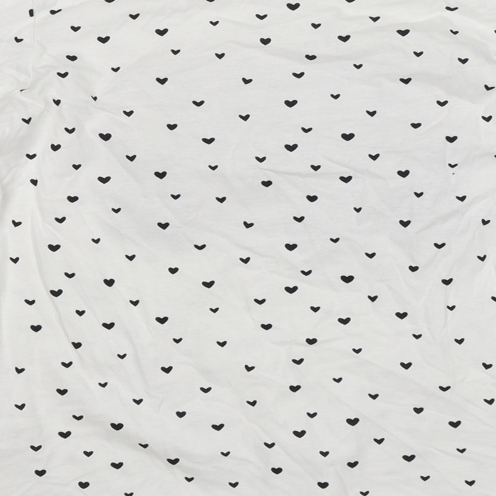 Brand and care label for Primark girls’ white polka dot jersey t-shirt, size 11-12, years - style icon