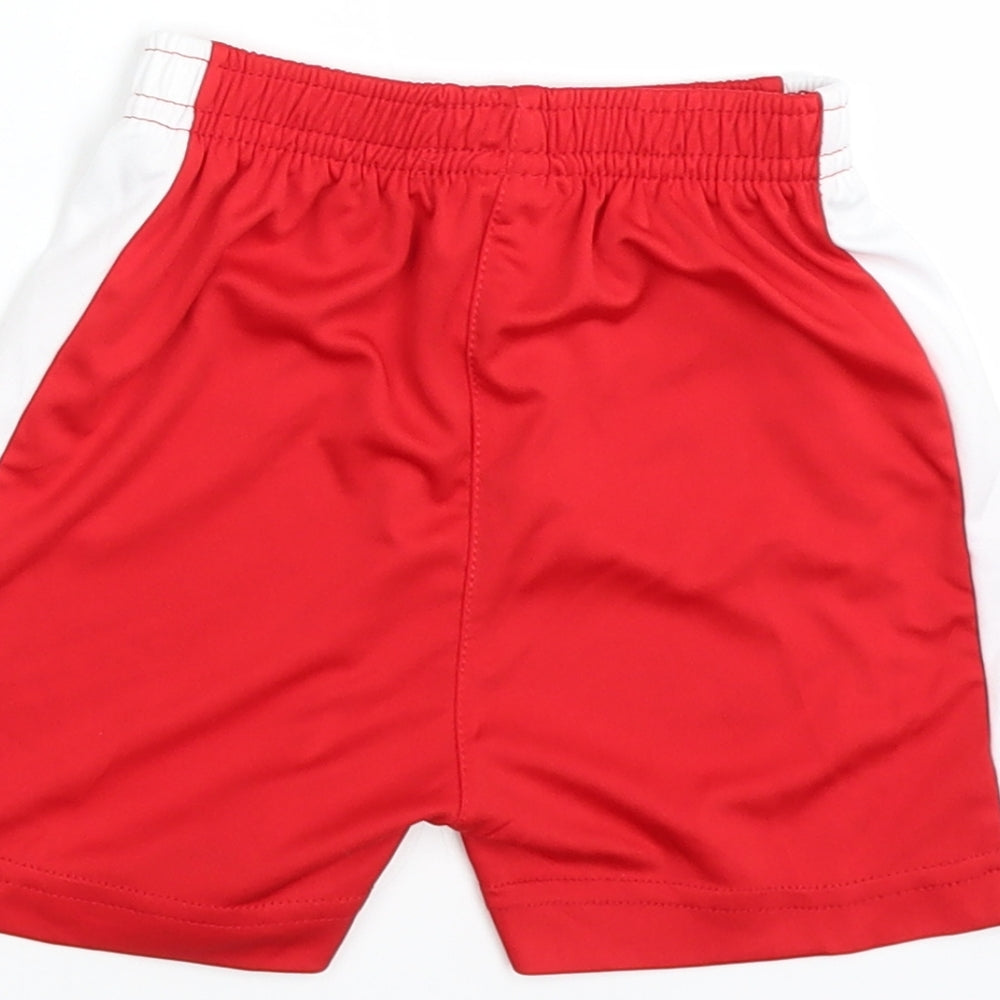 Brand and care label for Preworn boys’ red bermuda shorts, size 3, years