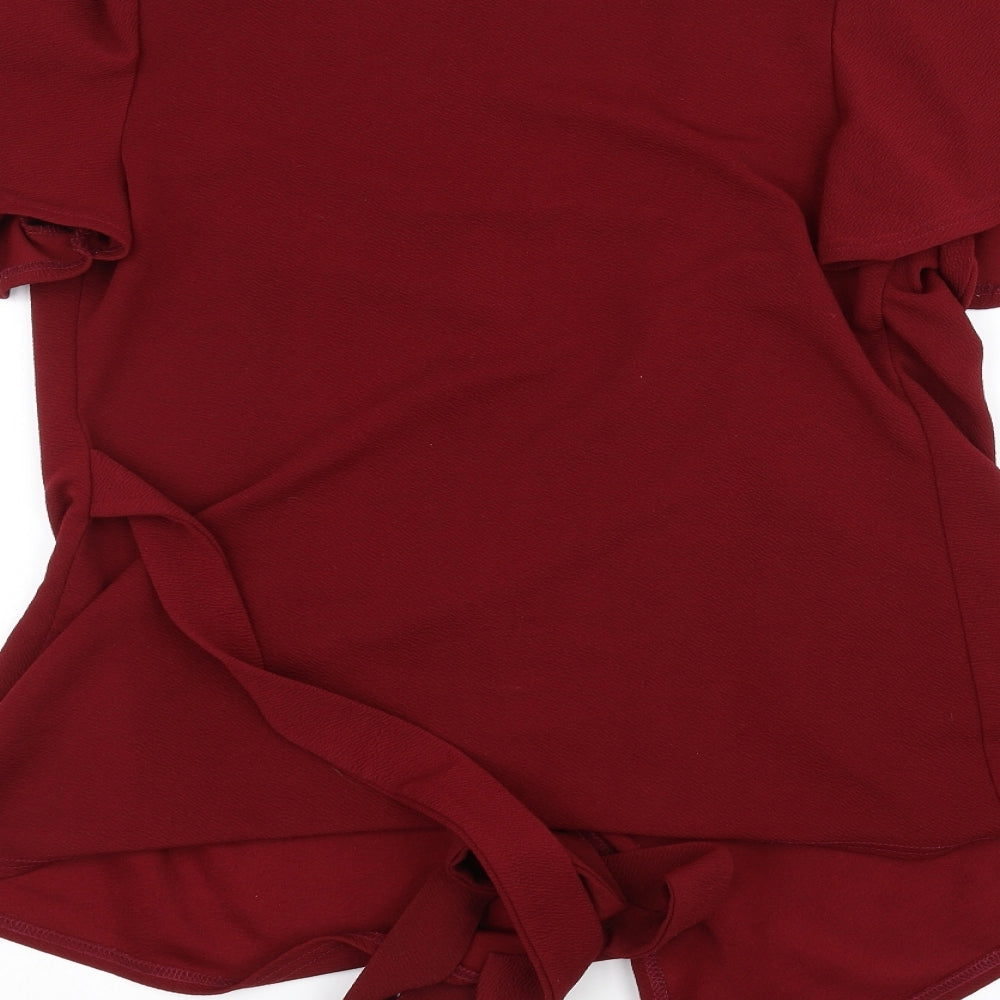 Brand and care label for Boohoo women’s red cardigan jumper, size UK 14