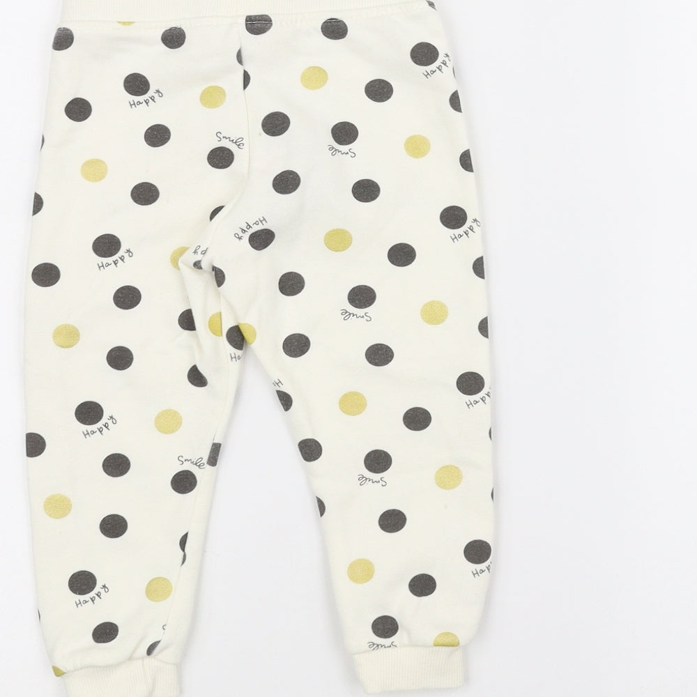 Brand and care label for Primark Baby White Polka Dot sweatpants, size 12-18, Months