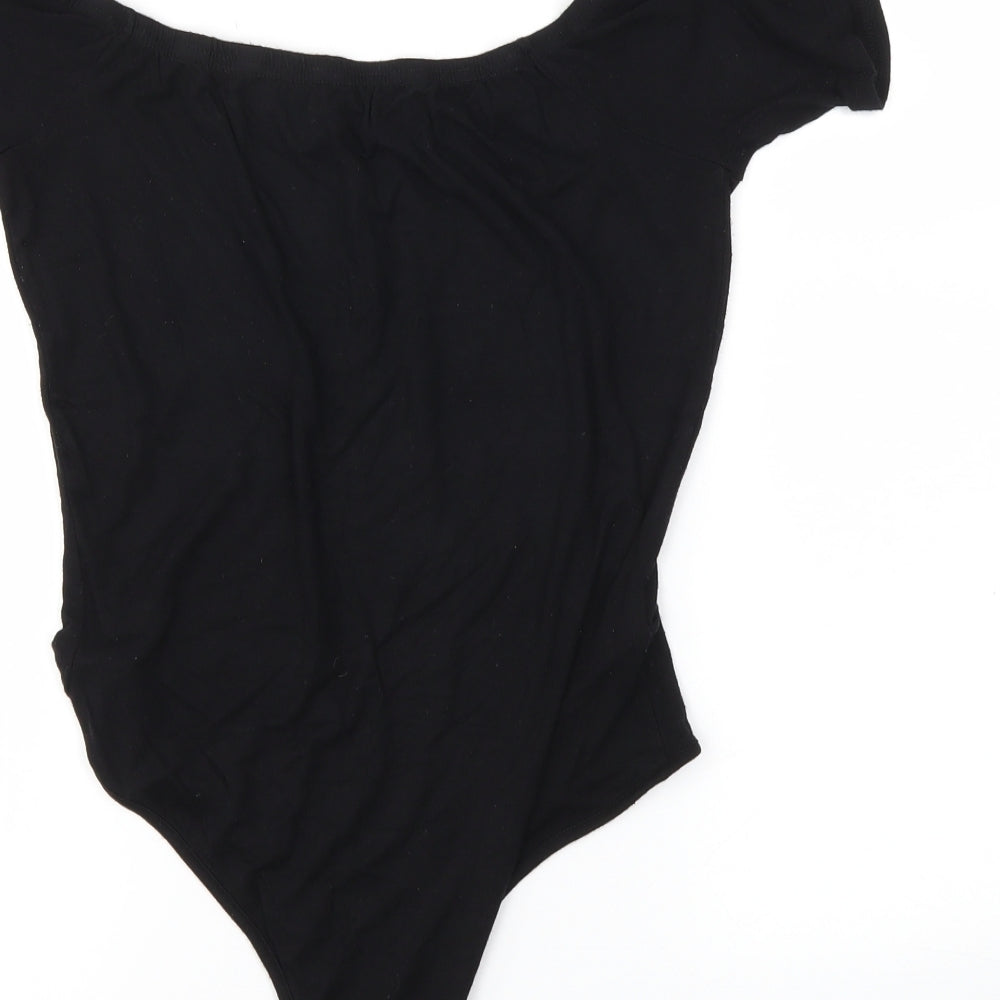 Brand and care label for PRETTYLITTLETHING women’s black bodysuit one-piece, size UK 10