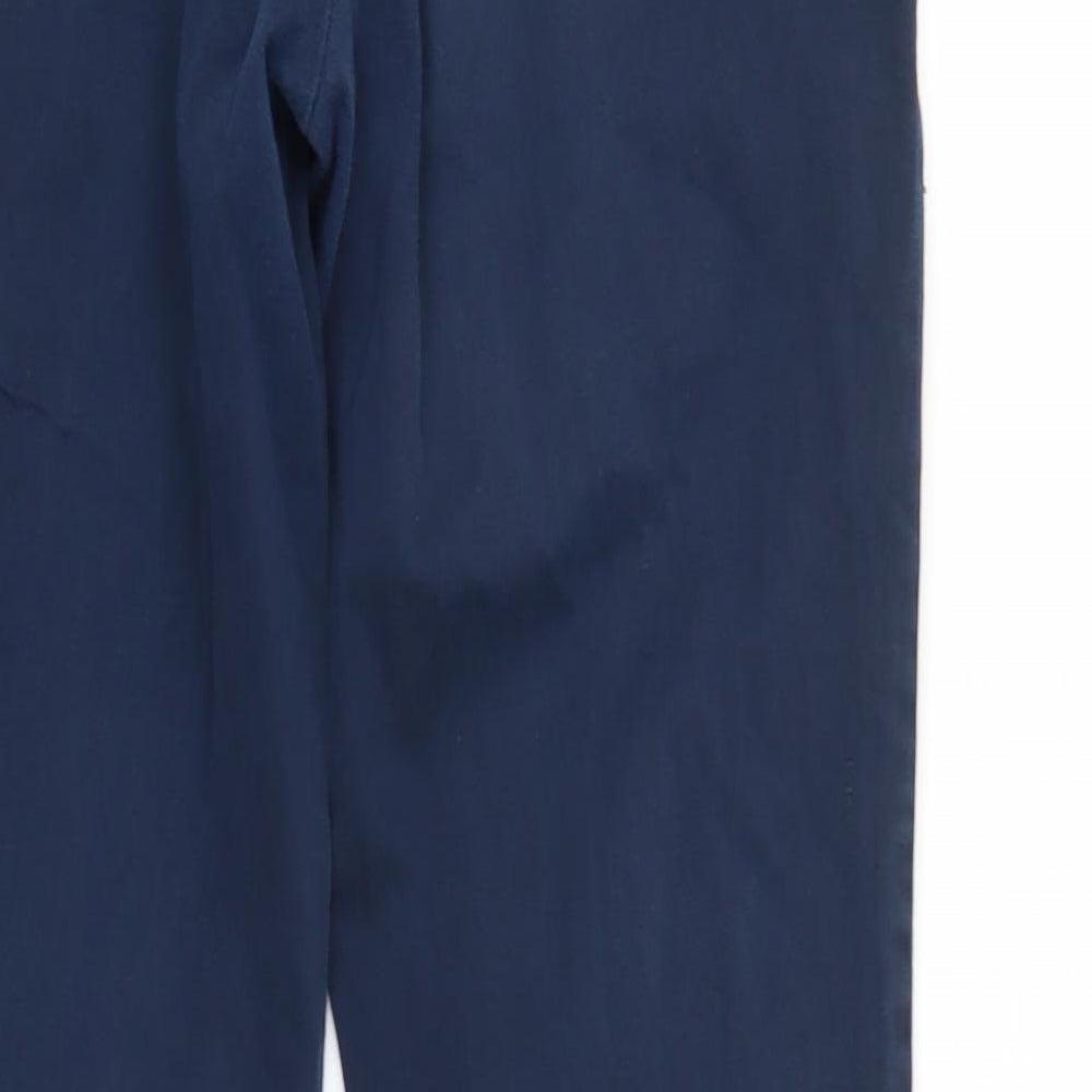 Brand and care label for Top man men’s blue carrot trousers, size 32, 27-inch leg