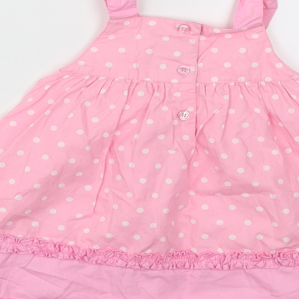 Brand and care label for George girls’ pink polka dot fit & flare, size 3-6, months