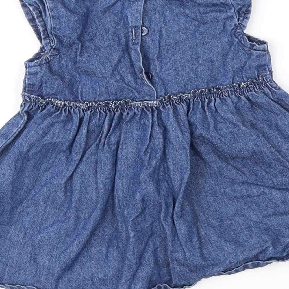 Brand and care label for Next girls’ blue denim fit & flare, size 0-3, months