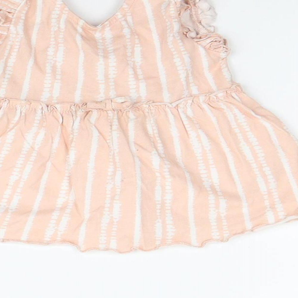 Brand and care label for George girls’ orange polka dot fit & flare, size 6-9, months
