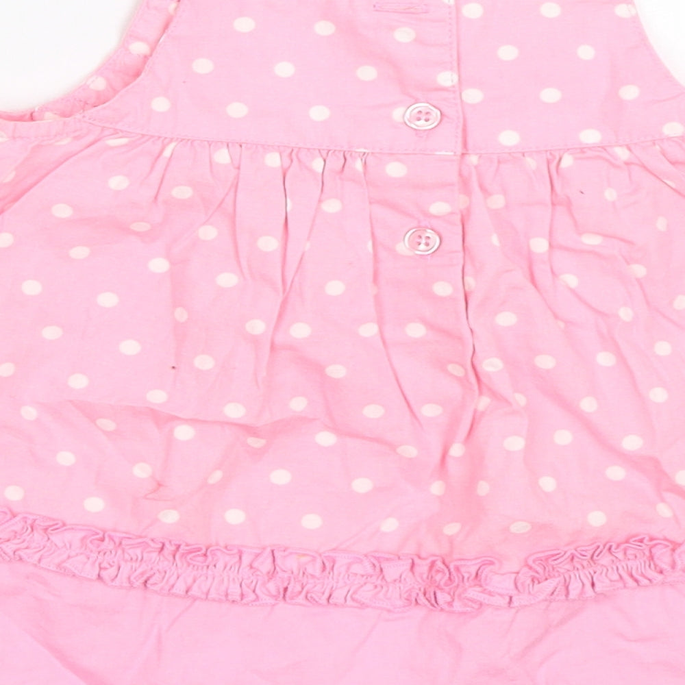 Brand and care label for George girls’ pink polka dot fit & flare, size 0-3, months