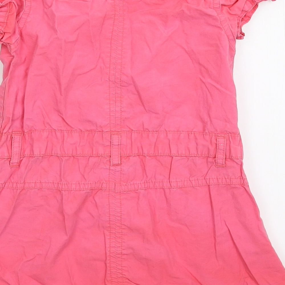 Brand and care label for Early Days girls’ pink shirt dress, size 18-24, months