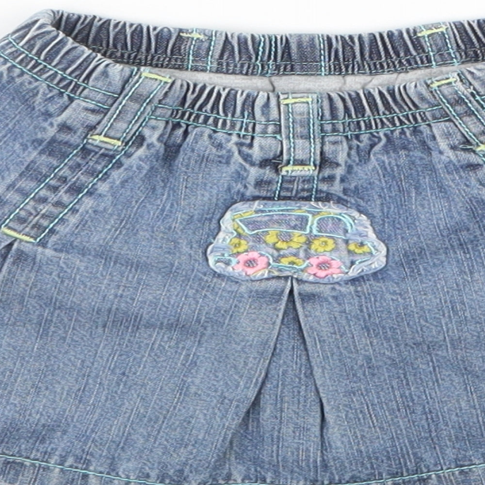 Brand and care label for Dudu girls’ blue denim a-line skirt, size 12, months