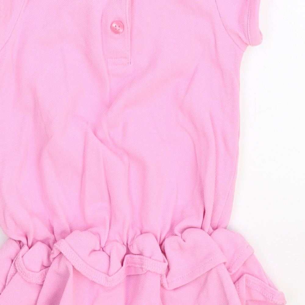 Brand and care label for George girls’ pink shirt dress, size 6-9, months