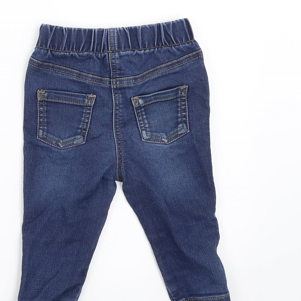 Brand and care label for Matalan girls’ blue denim jeans, size 6-9, months