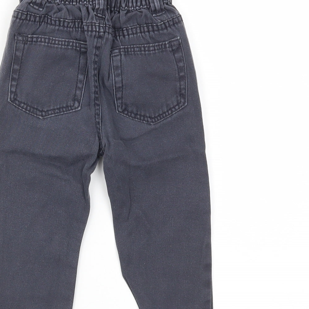 Brand and care label for Little Rebel boys’ blue denim snow pants jeans, size 12-18, months
