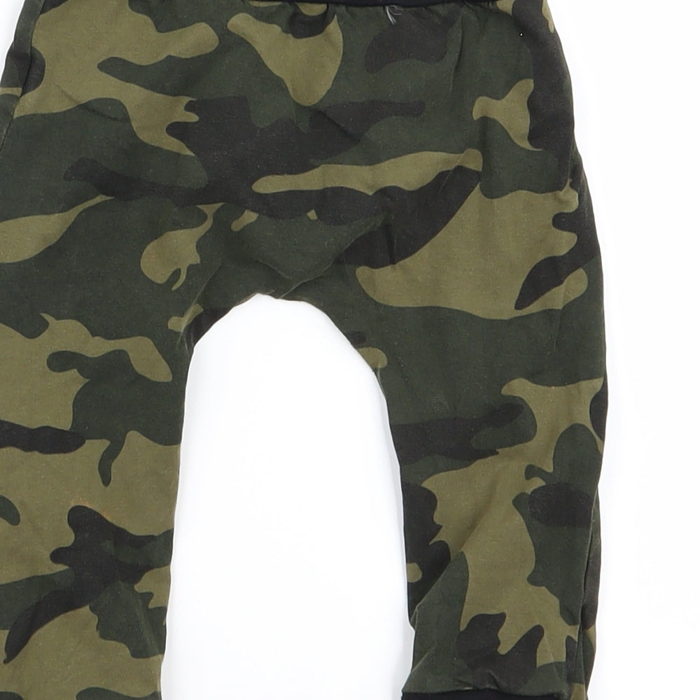 Brand and care label for Preworn Baby Green Camouflage Jogger Trousers, size 9, Months