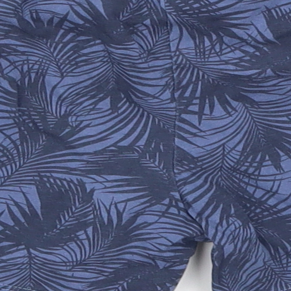 Brand and care label for Primark boys’ blue flecked sweatpants, size 18-24, months - palm leaves