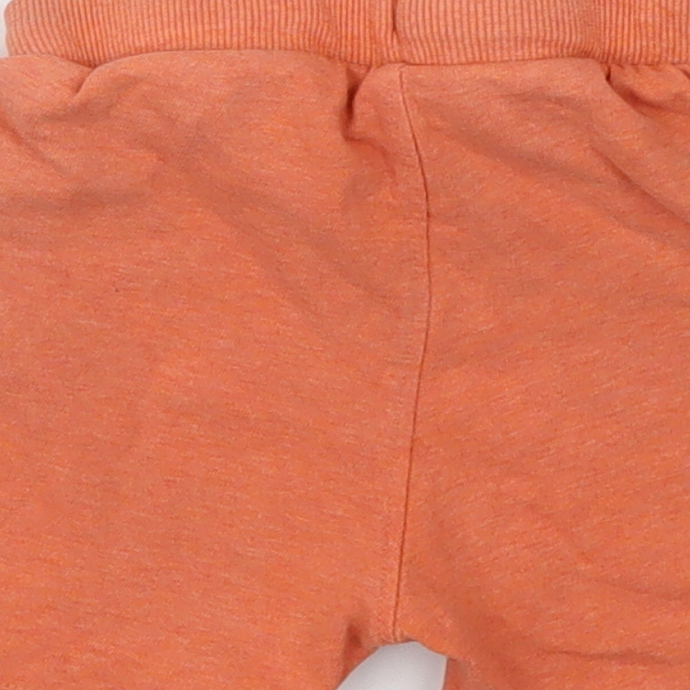 Brand and care label for Preworn Baby Orange Cropped Trousers, size 12-18, Months