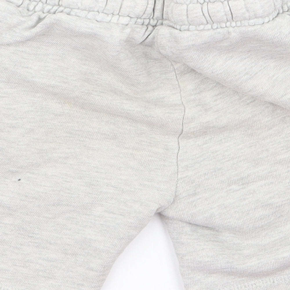 Brand and care label for mni club Baby Grey sweatpants, size 12, Months