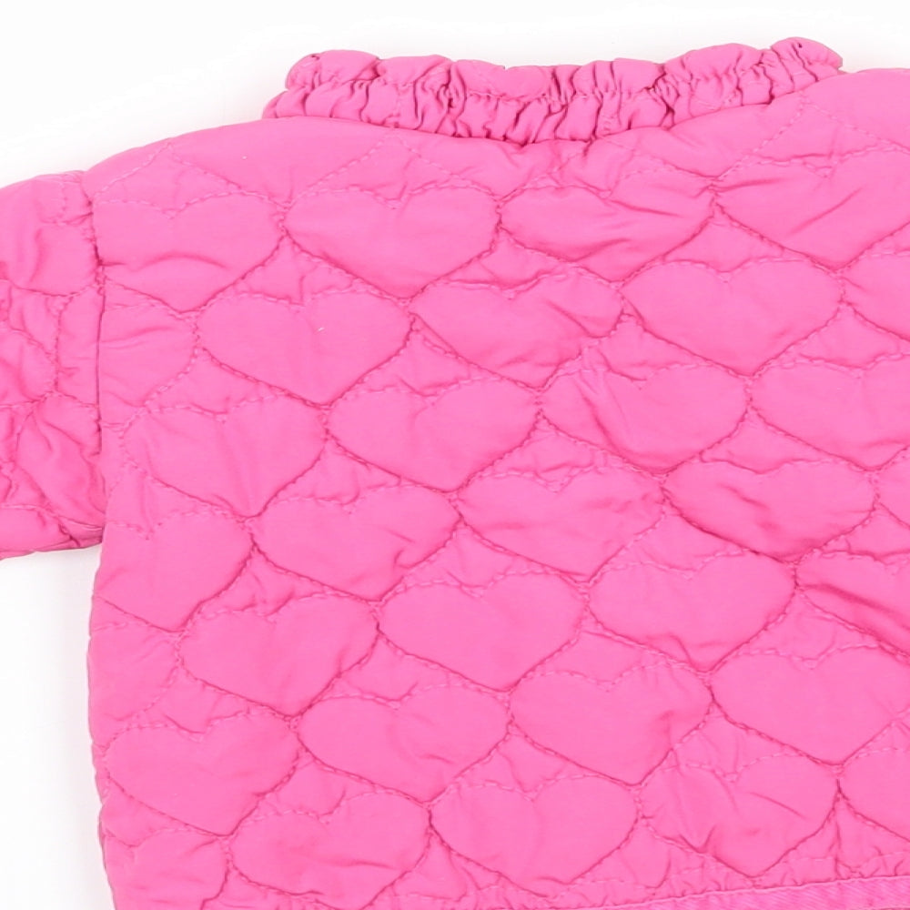 Brand and care label for Next girls’ pink puffer jacket jacket, size 0-3, months