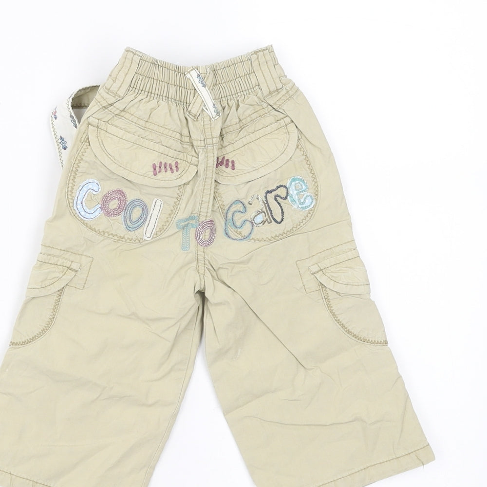 Brand and care label for Next girls’ beige trousers, size 9-12, months - embroidered detail