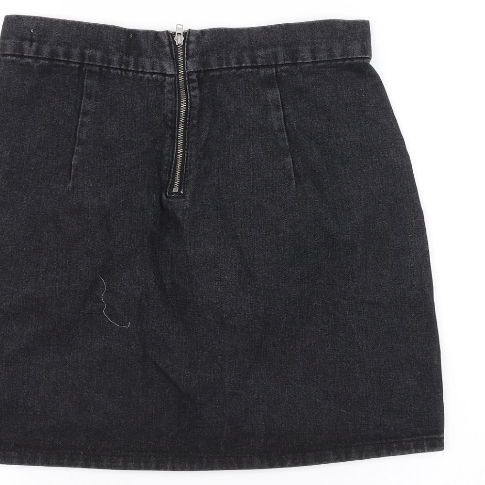 Brand and care label for Denim & Co. women’s black denim a-line skirt, size UK 8