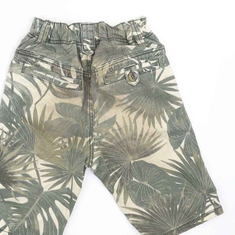 Brand and care label for TU boys’ green floral denim bermuda shorts, size 5, years