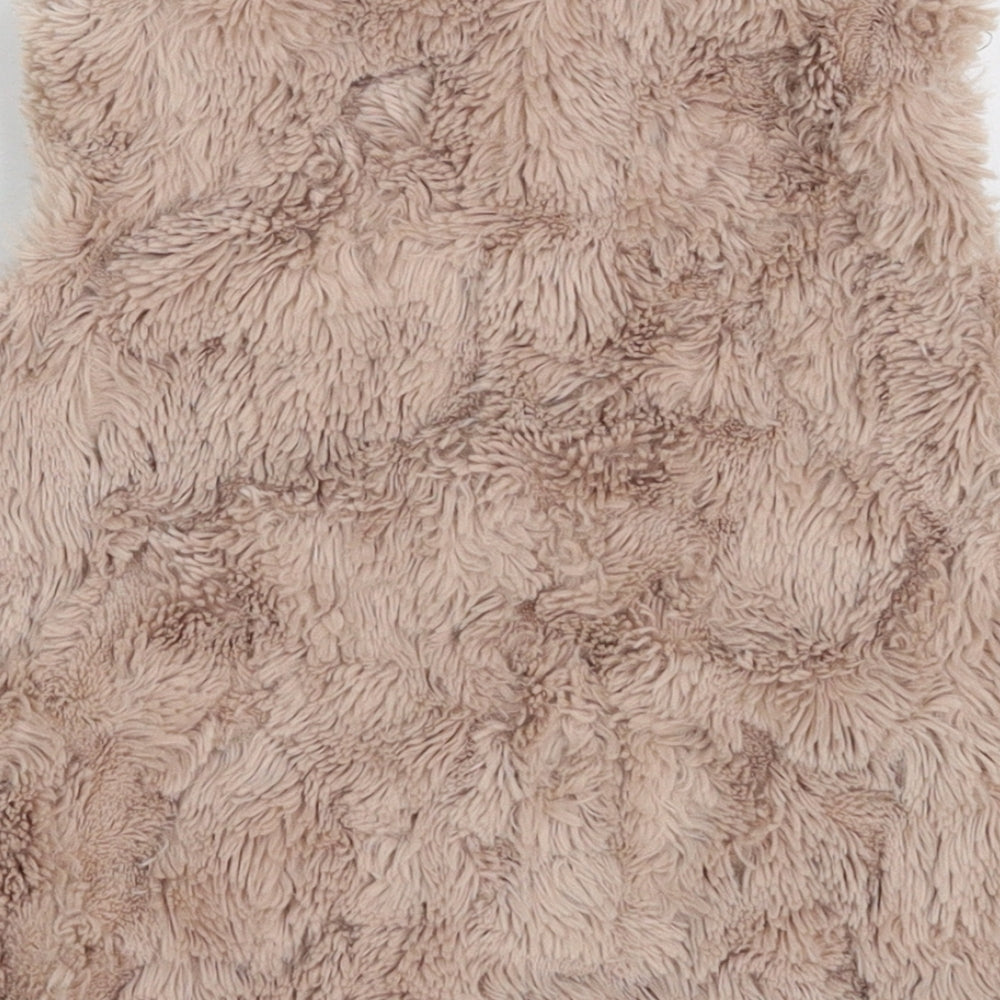 Brand and care label for Next girls’ beige gilet jacket, size 4, years