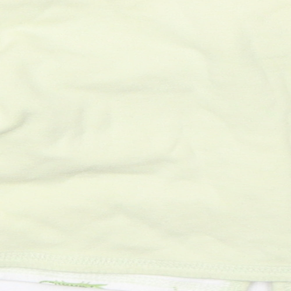 Brand and care label for Gap girls’ green jumper, size 0-3, months