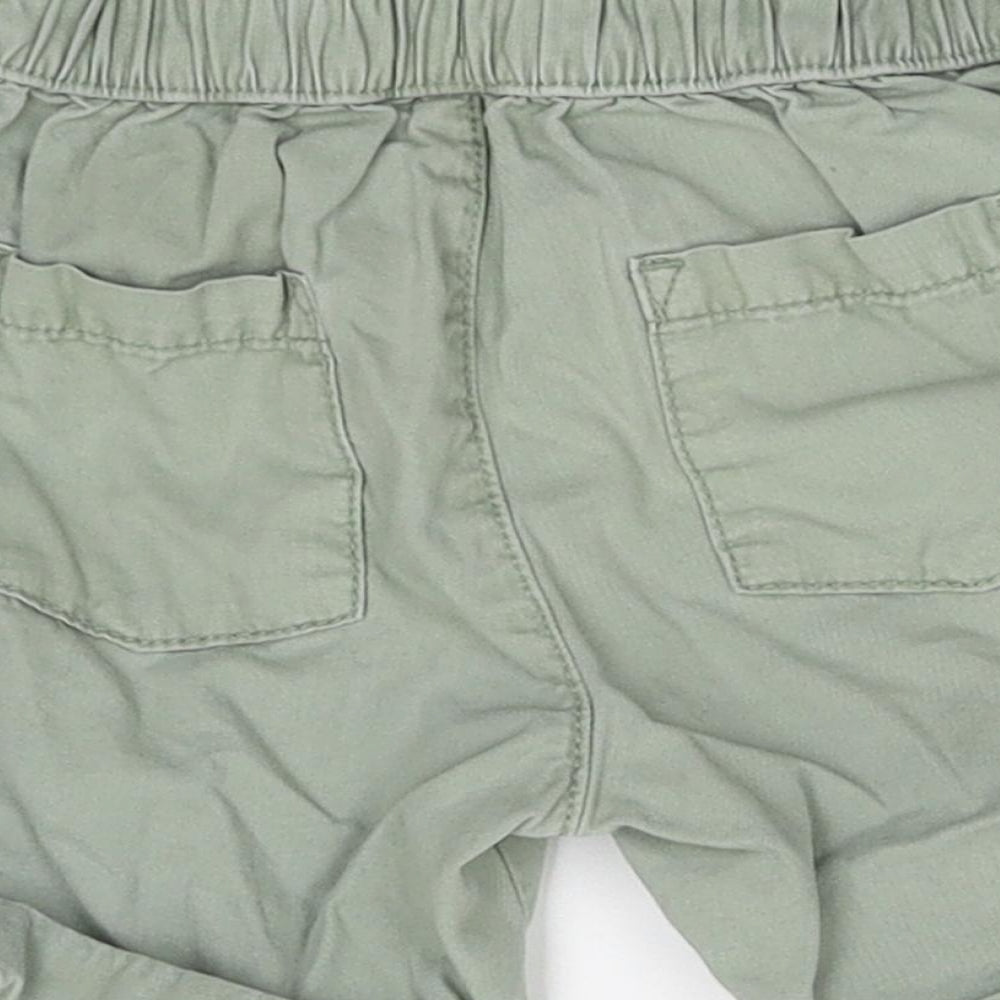 Brand and care label for F&F Baby Green Damask Cargo, size 12-18, Months
