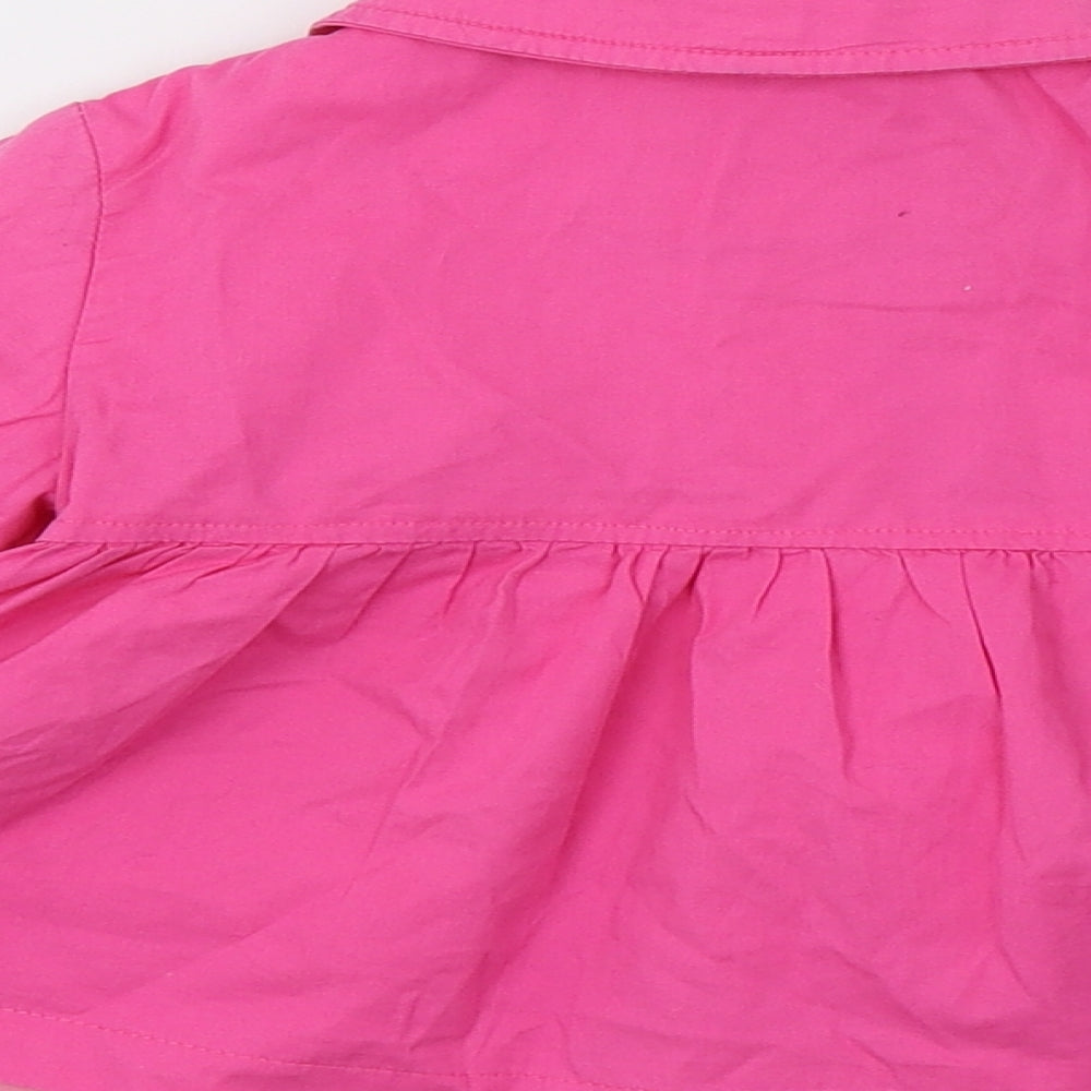 Brand and care label for Ladybird girls’ pink jacket, size 12-18, months