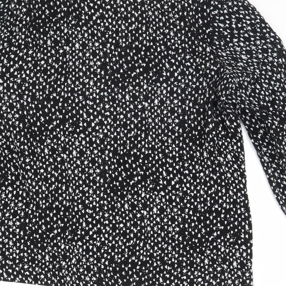 Brand and care label for Atmosphere women’s black polka dot jacket, size UK 12