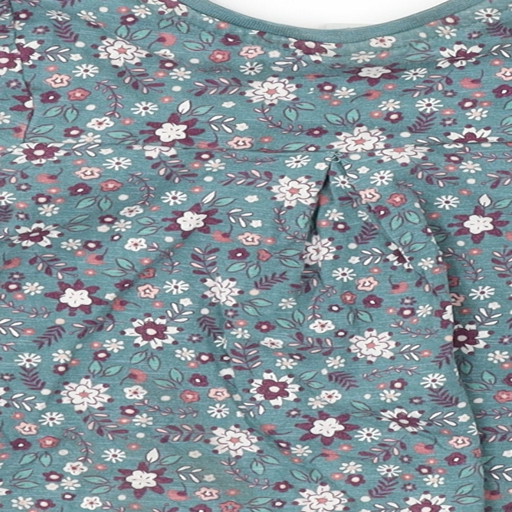 Brand and care label for Tu girls’ green floral camisole t-shirt, size 2, years