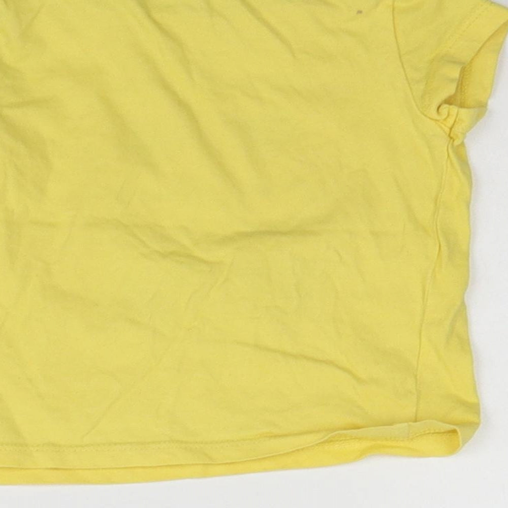 Brand and care label for Mothercare girls’ yellow basic t-shirt, size 12-18, months