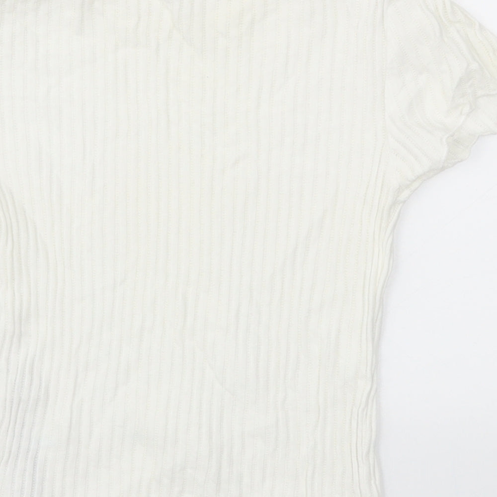 Brand and care label for Zara girls’ white basic t-shirt, size S