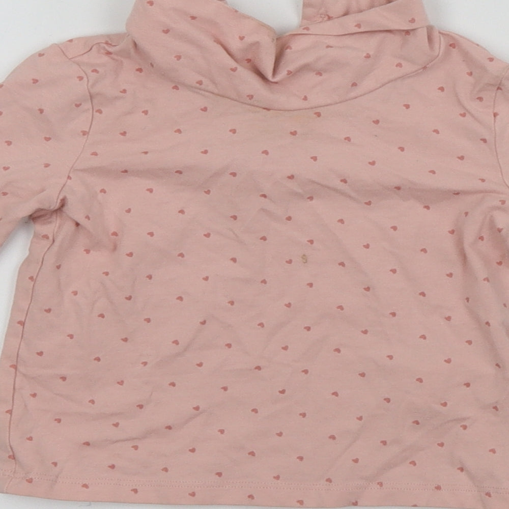 Brand and care label for Primark girls’ pink basic t-shirt, size 9-12, months