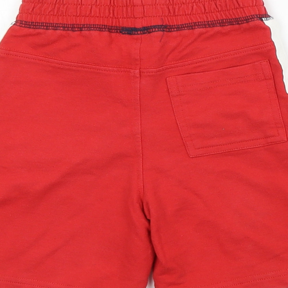 Brand and care label for F&F boys’ red sweatpants, size 12-18, months