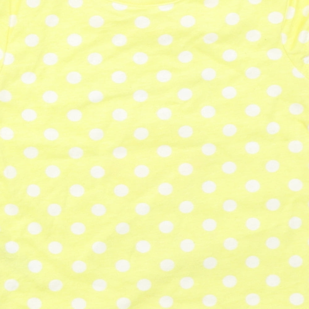 Brand and care label for George girls’ yellow polka dot basic t-shirt, size 0-3, months