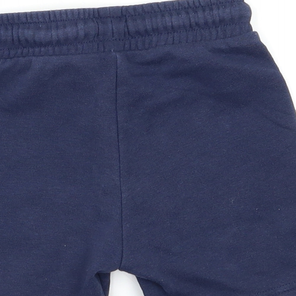 Brand and care label for F&F Baby Blue Cropped Trousers, size 18, Months