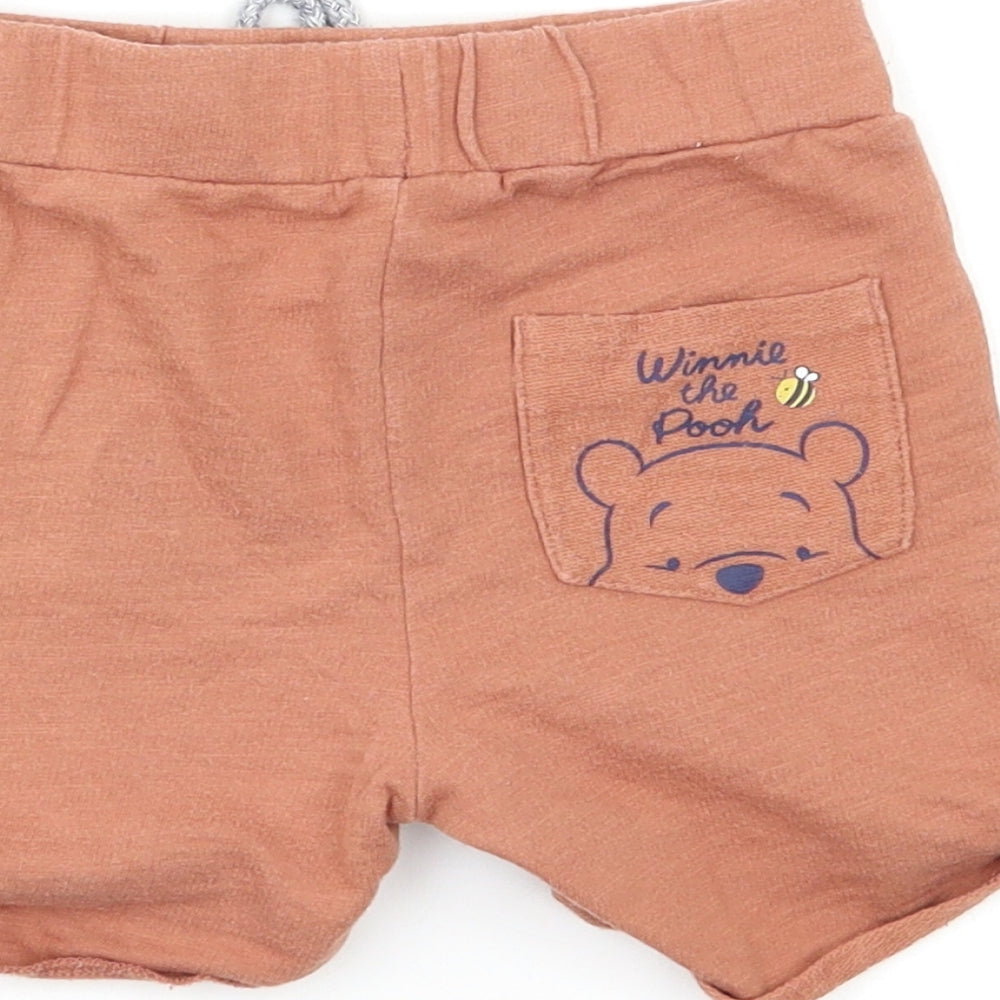 Brand and care label for Disney Baby Beige Cargo Trousers, size 12, Months - Winnie the Pooh