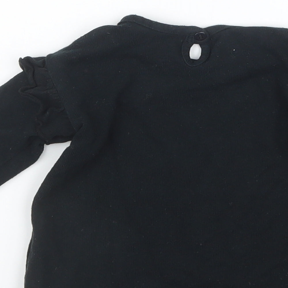Brand and care label for George girls’ black jumper, size 9-12, months