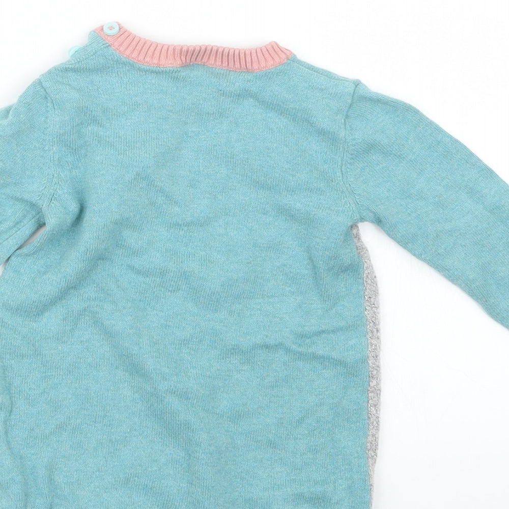 Brand and care label for Tu girls’ blue knit jumper, size 6-9, months