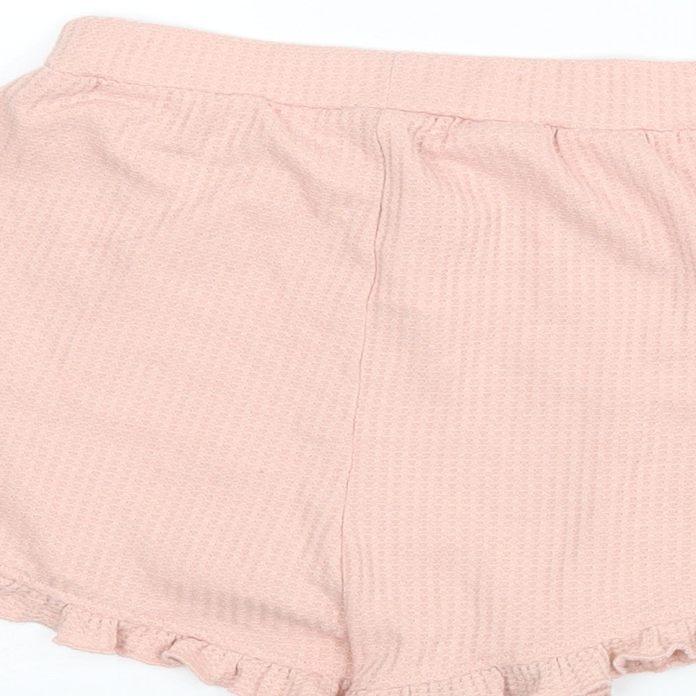 Brand and care label for ASOS women’s pink hot pants shorts, size UK 6