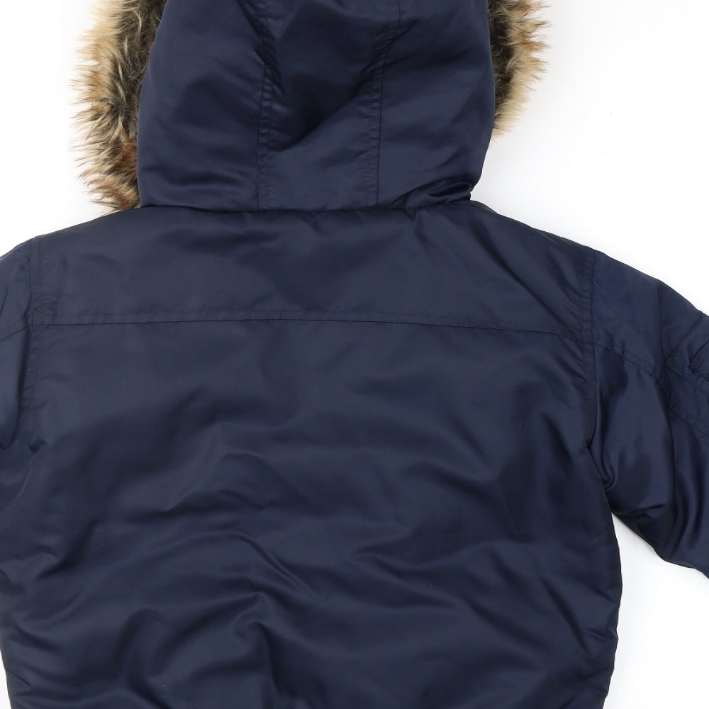 Brand and care label for Ripstop. boys’ blue anorak jacket, size XS