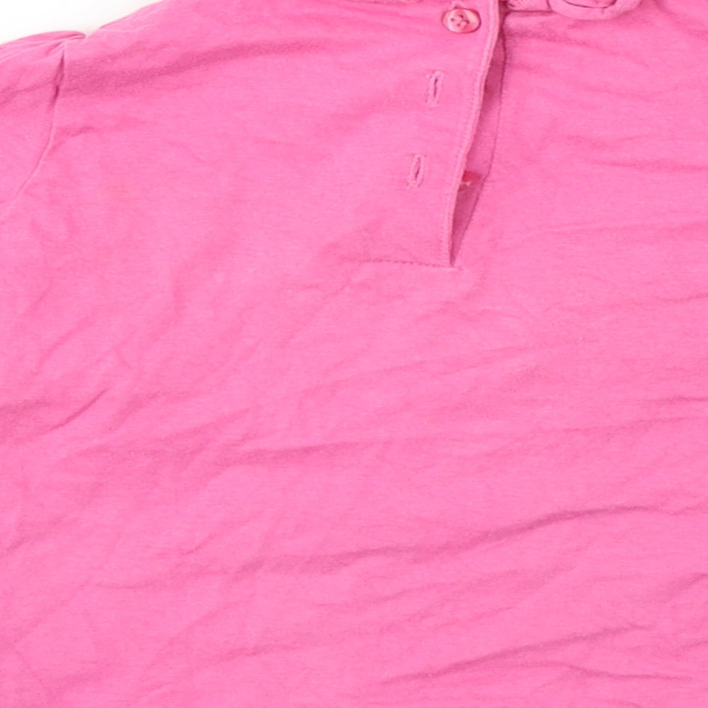 Brand and care label for Preworn girls’ pink basic t-shirt, size 12-18, months