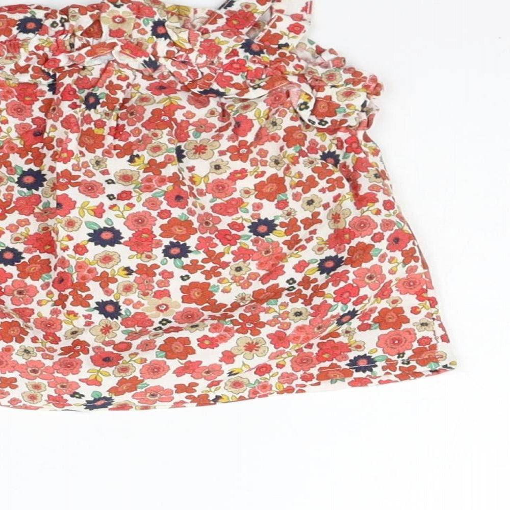 Brand and care label for Matalan girls’ beige floral a-line, size 9-12, months