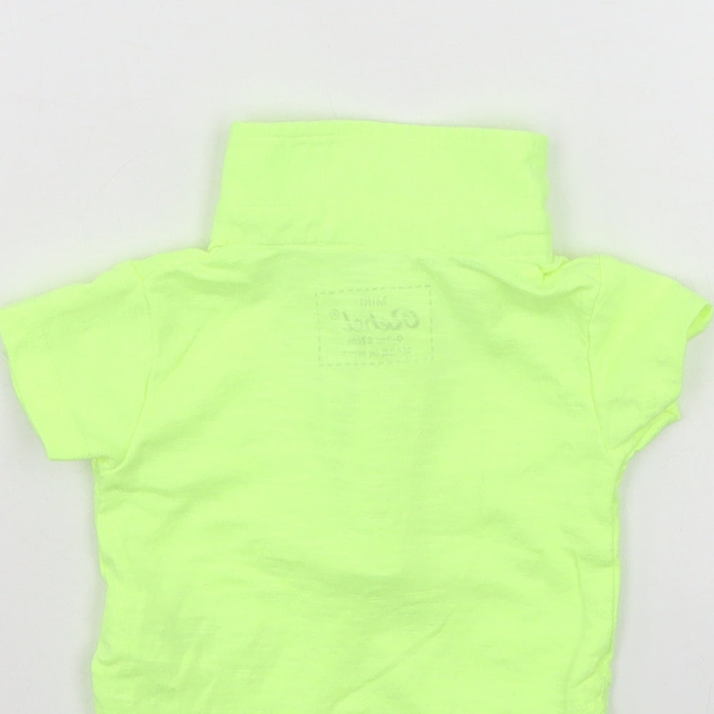 Brand and care label for Mini Rebel boys’ green basic polo, size 0-3, months