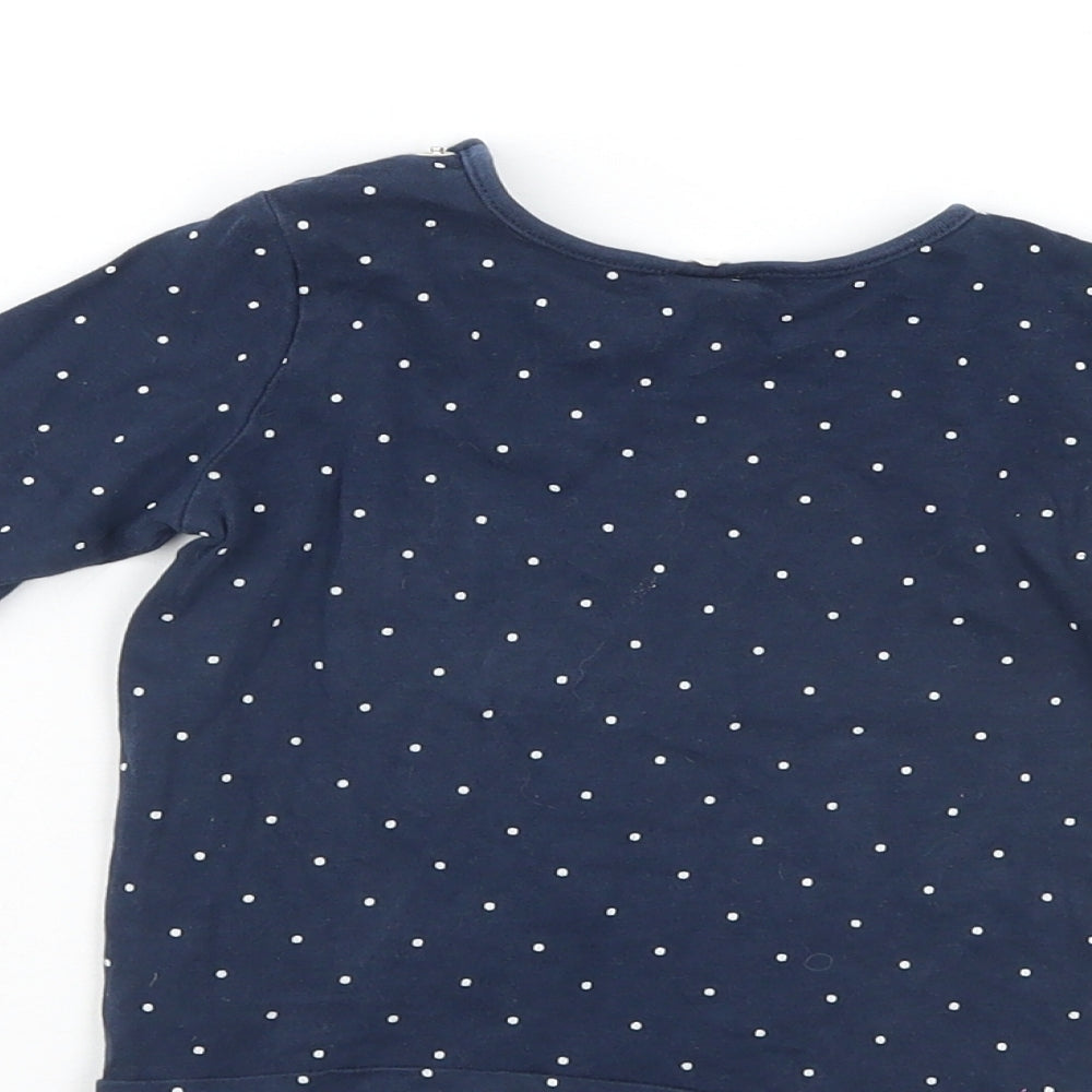 Brand and care label for H&M boys’ blue polka dot jumper, size 12-18, months