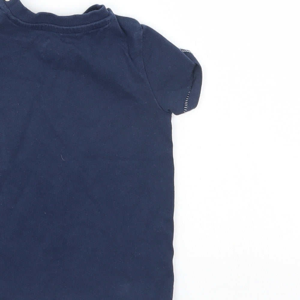 Brand and care label for F&F boys’ blue basic t-shirt, size 6-9, months