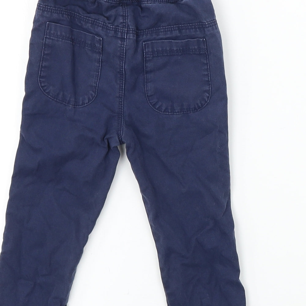 Brand and care label for Matalan boys’ blue cargo trousers, size 6-9, months