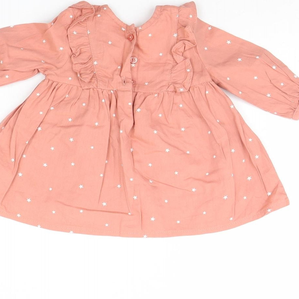 Brand and care label for Next girls’ pink fit & flare, size 0-3, months - star detail